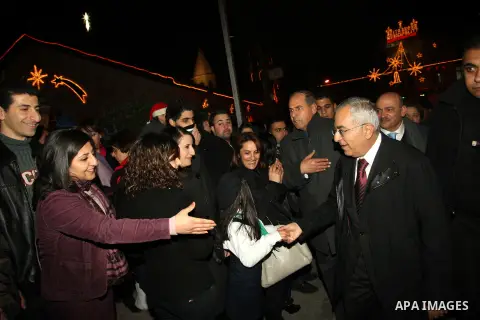 Palestinian Prime Minister Salam Fayyad attends the lighting ceremony of a Christmas tree in the village of Beit Sahour near the West Bank city of Bethlehem on 20 December 2012. Photo by Mustafa Abu Dayeh