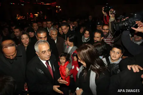 Palestinian Prime Minister Salam Fayyad attends the lighting ceremony of a Christmas tree in the village of Beit Sahour near the West Bank city of Bethlehem on 20 December 2012. Photo by Mustafa Abu Dayeh