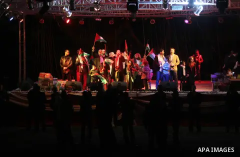 Palestinian Prime Minister in Gaza strip Ismail Haniyeh, Share with Members of the Birds of Paradise team sing during an Islamic song festival in Gaza City on December 20, 2012. Photo by Ezz Zanoun
