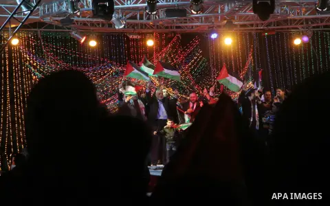 Palestinian Prime Minister in Gaza strip Ismail Haniyeh, Share with Members of the Birds of Paradise team sing during an Islamic song festival in Gaza City on December 20, 2012. Photo by Ezz Zanoun