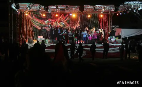 Palestinian Prime Minister in Gaza strip Ismail Haniyeh, Share with Members of the Birds of Paradise team sing during an Islamic song festival in Gaza City on December 20, 2012. Photo by Ezz Zanoun