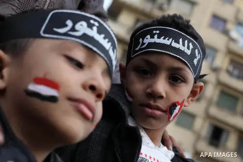 Egyptian protesters gather for a demonstration at Tahrir square in Cairo, Egypt, Friday, Dec. 21, 2012. Running clashes between rival protesters erupted in Egypt's second city Alexandria, on the eve of the final round of...