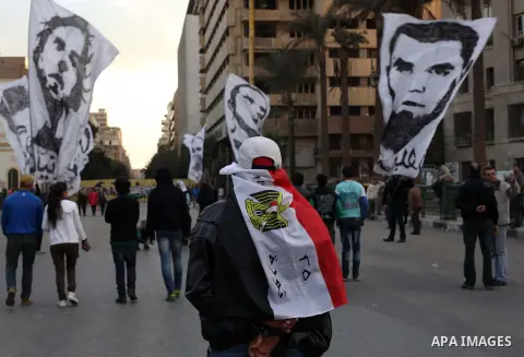 Egyptian protesters gather for a demonstration at Tahrir square in Cairo, Egypt, Friday, Dec. 21, 2012. Running clashes between rival protesters erupted in Egypt's second city Alexandria, on the eve of the final round of...