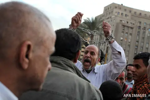 Egyptian protesters gather for a demonstration at Tahrir square in Cairo, Egypt, Friday, Dec. 21, 2012. Running clashes between rival protesters erupted in Egypt's second city Alexandria, on the eve of the final round of...