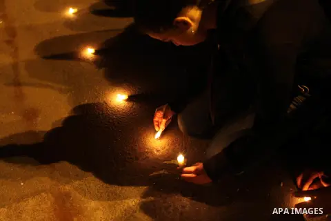 Egyptian protesters place candles as they gather at Tahrir square in Cairo, Egypt, Friday, Dec. 21, 2012. Running clashes between rival protesters erupted in Egypt's second city Alexandria, on the eve of the final round...
