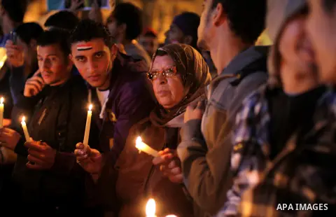 Egyptian protesters hold candles as they gather at Tahrir square in Cairo, Egypt, Friday, Dec. 21, 2012. Running clashes between rival protesters erupted in Egypt's second city Alexandria, on the eve of the final round o...