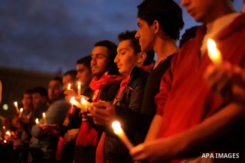 Egyptian protesters hold candles as they gather at Tahrir square in Cairo, Egypt, Friday, Dec. 21, 2012. Running clashes between rival protesters erupted in Egypt's second city Alexandria, on the eve of the final round o...