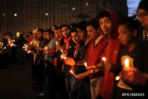 Egyptian protesters hold candles as they gather at Tahrir square in Cairo, Egypt, Friday, Dec. 21, 2012. Running clashes between rival protesters erupted in Egypt's second city Alexandria, on the eve of the final round o...