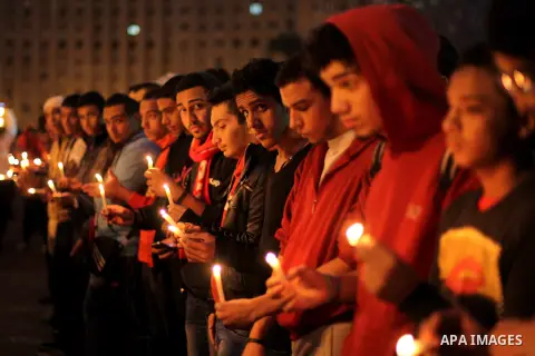 Egyptian protesters hold candles as they gather at Tahrir square in Cairo, Egypt, Friday, Dec. 21, 2012. Running clashes between rival protesters erupted in Egypt's second city Alexandria, on the eve of the final round o...