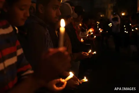 Egyptian protesters hold candles as they gather at Tahrir square in Cairo, Egypt, Friday, Dec. 21, 2012. Running clashes between rival protesters erupted in Egypt's second city Alexandria, on the eve of the final round o...