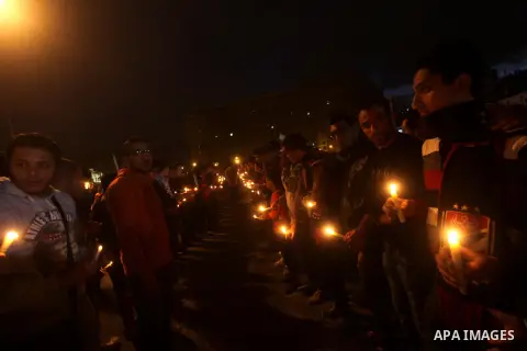 Egyptian protesters hold candles as they gather at Tahrir square in Cairo, Egypt, Friday, Dec. 21, 2012. Running clashes between rival protesters erupted in Egypt's second city Alexandria, on the eve of the final round o...