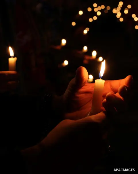 Egyptian protesters hold candles as they gather at Tahrir square in Cairo, Egypt, Friday, Dec. 21, 2012. Running clashes between rival protesters erupted in Egypt's second city Alexandria, on the eve of the final round o...