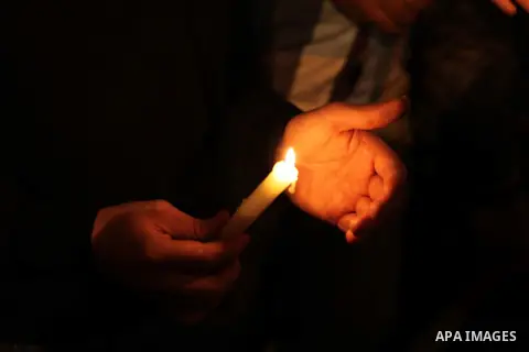 Egyptian protesters hold candles as they gather at Tahrir square in Cairo, Egypt, Friday, Dec. 21, 2012. Running clashes between rival protesters erupted in Egypt's second city Alexandria, on the eve of the final round o...