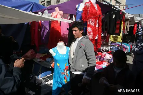 A Palestinian vendor display his goods at the saturday's popular market in Rafah southern Gaza strip on 22 December 2012. Normal life in Gaza resumed remarkably fast after a ceasefire agreement was announced following ei...