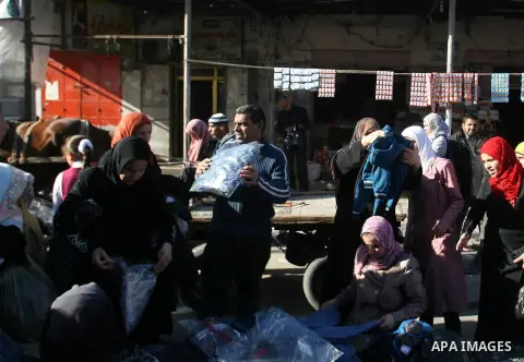 Palestinians shop at the saturday's popular market in Rafah southern Gaza strip on 22 December 2012. Normal life in Gaza resumed remarkably fast after a ceasefire agreement was announced following eight days of cross bor...
