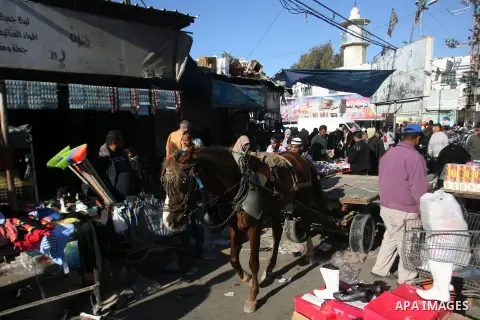 Palestinians shop at the saturday's popular market in Rafah southern Gaza strip on 22 December 2012. Normal life in Gaza resumed remarkably fast after a ceasefire agreement was announced following eight days of cross bor...