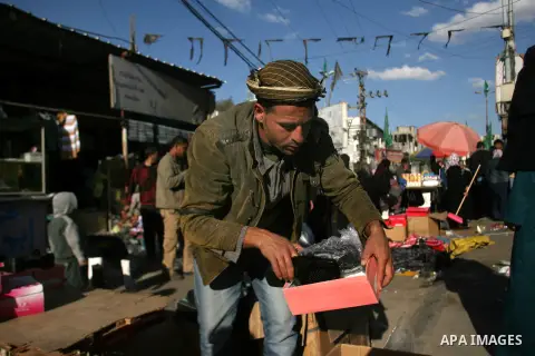 A Palestinian vendor display his goods at the saturday's popular market in Rafah southern Gaza strip on 22 December 2012. Normal life in Gaza resumed remarkably fast after a ceasefire agreement was announced following ei...