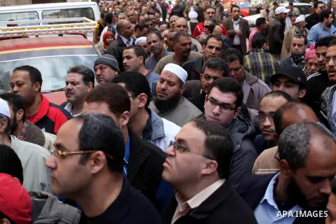 Egyptian voters gather at a polling station during the second round of a referendum on a new draft constitution in Giza, south of Cairo, on December 22, 2012. Egyptians are voting in the final round of a referendum on a...