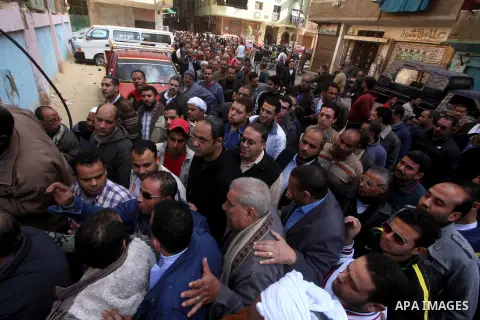 Egyptian voters gather at a polling station during the second round of a referendum on a new draft constitution in Giza, south of Cairo, on December 22, 2012. Egyptians are voting in the final round of a referendum on a...