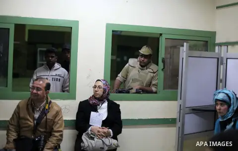 Officials count ballots after polls closed in Giza, south of Cairo, on December 22, 2012. Egyptians are voting in the final round of a referendum on a new constitution championed by President Mohamed Morsi and his Islami...