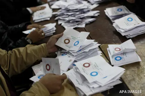 Officials count ballots after polls closed in Giza, south of Cairo, on December 22, 2012. Egyptians are voting in the final round of a referendum on a new constitution championed by President Mohamed Morsi and his Islami...