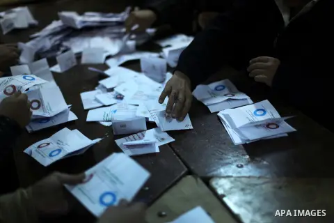 Officials count ballots after polls closed in Giza, south of Cairo, on December 22, 2012. Egyptians are voting in the final round of a referendum on a new constitution championed by President Mohamed Morsi and his Islami...