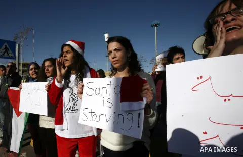 Protesters hold placards during a demonstration in Jerusalem calling for the release of Palestinian prisoners from Israeli jails December 23, 2012. Photo by Mahfouz Abu Turk