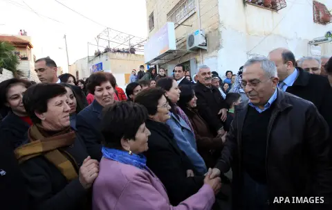 Palestinian Prime Minister Salam Fayyad, during the lighting of the Christmas tree in the church of Latin in the West Bank village of Zababda of Jenin , on December 23, 2012. Photo by Mustafa Abu Dayeh