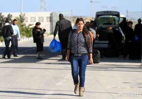 A Palestinian Christian walks towards Erez crossing in the northern Gaza Strip on Dec. 24, 2012 after Israel granted 557 permits for Christians from the isolated and impoverished territory to travel to the West Bank town...