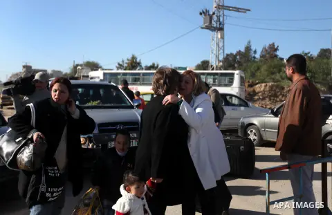 Palestinian Christians walk towards Erez crossing in the northern Gaza Strip on Dec. 24, 2012 after Israel granted 557 permits for Christians from the isolated and impoverished territory to travel to the West Bank town o...
