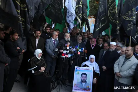 Palestinian members of National and Islamic movements speak during a rally in Gaza city on December 24, 2012. in solidarity with hunger-striking detainees held by Israel to demand their release from detention without tri...