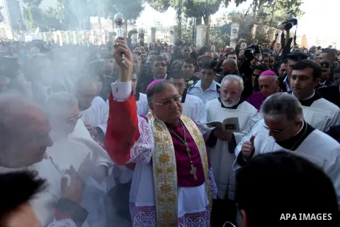 The Latin Patriarch of Jerusalem, Fouad Twal, arrives to Manger Square as he make his way to the Church of the Nativity, where Christians believe the Virgin Mary gave birth to Jesus Christ, in the West Bank town of Bethl...