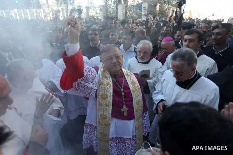 The Latin Patriarch of Jerusalem, Fouad Twal, arrives to Manger Square as he make his way to the Church of the Nativity, where Christians believe the Virgin Mary gave birth to Jesus Christ, in the West Bank town of Bethl...