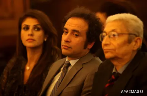 Egyptian National Rescue Front member Amr Hamzawy attends Christmas mass in Cairo, on December 24, 2012. Photo by Ashraf Amra