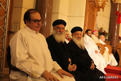 Christians attend Christmas mass in Cairo, on December 24, 2012. Photo by Ashraf Amra