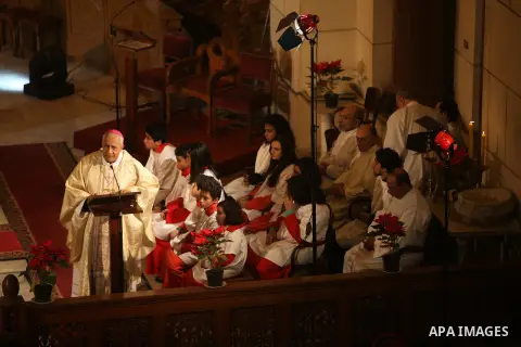 A Christian priest celebrates Christmas mass in Cairo, on December 24, 2012. Photo by Ashraf Amra