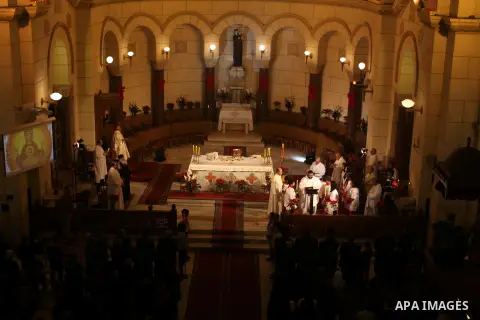 Christians attend Christmas mass in Cairo, on December 24, 2012. Photo by Ashraf Amra