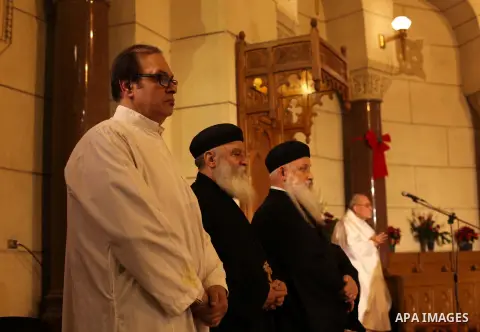 Christians attend Christmas mass in Cairo, on December 24, 2012. Photo by Ashraf Amra