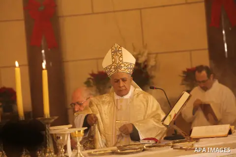 A Christian priest celebrates Christmas mass in Cairo, on December 24, 2012. Photo by Ashraf Amra