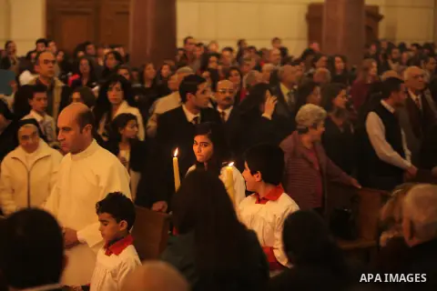 Christians attend Christmas mass in Cairo, on December 24, 2012. Photo by Ashraf Amra