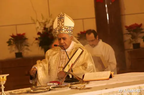 A Christian priest celebrates Christmas mass in Cairo, on December 24, 2012. Photo by Ashraf Amra