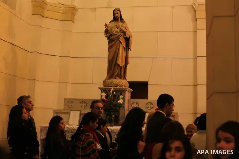 Christians attend Christmas mass in Cairo, on December 24, 2012. Photo by Ashraf Amra