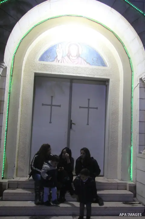 Palestinians Christian take part in the celebrations at a church of Deir Latin, during Christmas celebrations in Gaza city, on December 24, 2012. Photo by Ezz al-Zanoon