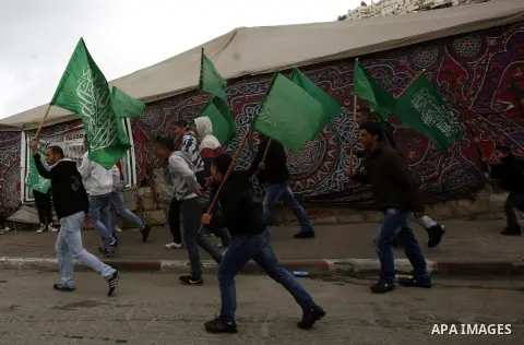 Palestinians celebrate after the Israeli authorities released prisoner Mousa Oudeh from neighborhood of Silwan in Jerusalem on December 26, 2012. Oudeh is a member of the committee for the defense of Silwan, spent two mo...