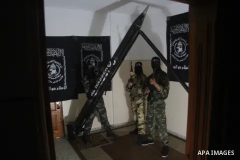 Militants of El-Naser Salah El-Deen brigades of the popular resistance, during they prefabricate a homemade rockets named (Al Naser 5) , marking the 4 th anniversary of the Israel-Gaza war, in Gaza City, on Dec. 27, 2012...