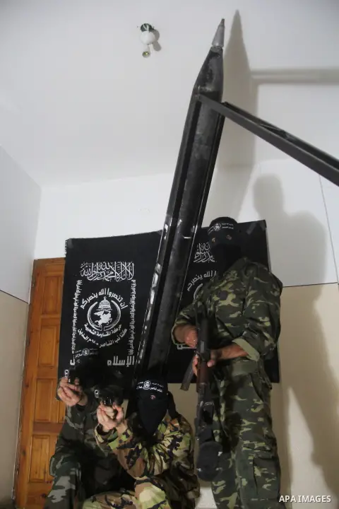 Militants of El-Naser Salah El-Deen brigades of the popular resistance, during they prefabricate a homemade rockets named (Al Naser 5) , marking the 4 th anniversary of the Israel-Gaza war, in Gaza City, on Dec. 27, 2012...