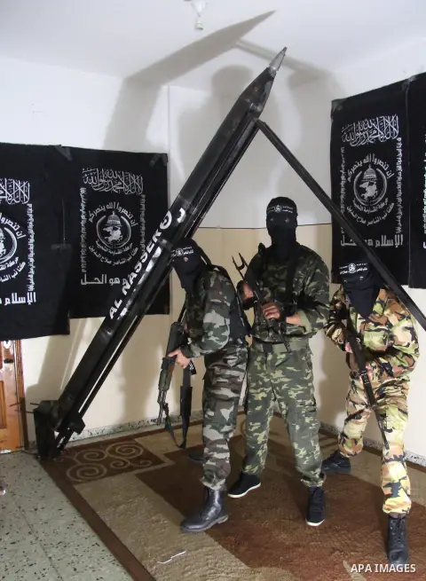 Militants of El-Naser Salah El-Deen brigades of the popular resistance, during they prefabricate a homemade rockets named (Al Naser 5) , marking the 4 th anniversary of the Israel-Gaza war, in Gaza City, on Dec. 27, 2012...