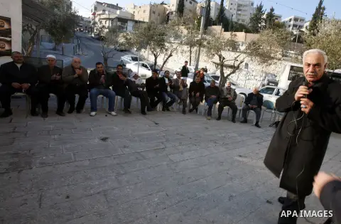 Palestinians gather in front of the Red Cross offices during sit-in outside the Red Cross offices to show solidarity with Palestinian prisoner Samer Issawi who held in an Israeli jail and on hunger strike since August 1...