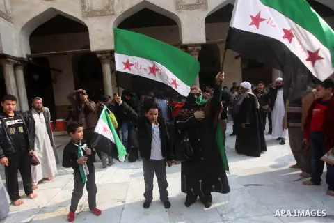 Egyptian protestors gather during a rally in support of the Syrian people and against Syria's President Bashar al-Assad at Al-Azhar mosque in Cairo, on December 28, 2012. Syrian warplanes launched air raids in Damascus p...