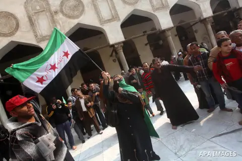 Egyptian protestors gather during a rally in support of the Syrian people and against Syria's President Bashar al-Assad at Al-Azhar mosque in Cairo, on December 28, 2012. Syrian warplanes launched air raids in Damascus p...